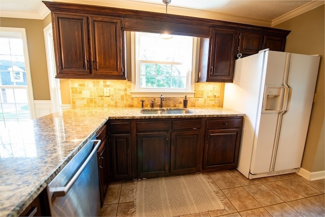 kitchen with sink, tasteful backsplash, dishwasher, white fridge with ice dispenser, and light stone countertops