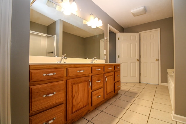 bathroom with vanity, an enclosed shower, and tile patterned floors