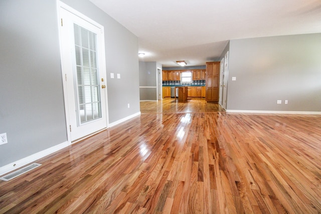 unfurnished living room featuring light hardwood / wood-style floors