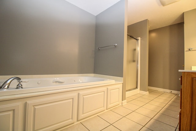 bathroom with tile patterned floors and separate shower and tub