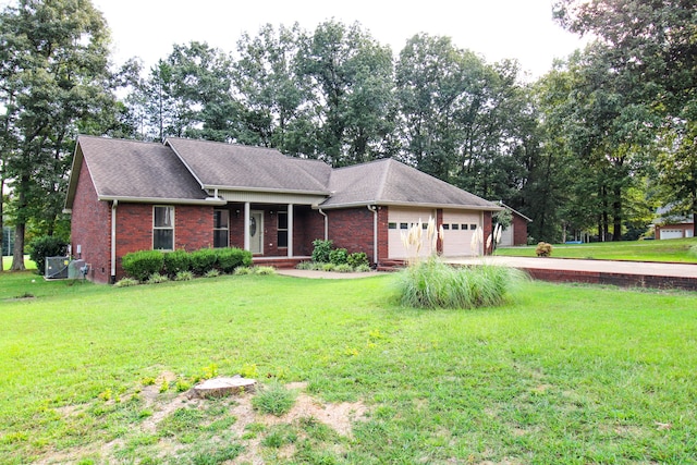 ranch-style house featuring a front yard and a garage