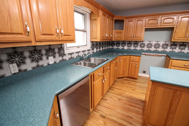 kitchen with light hardwood / wood-style flooring, sink, tasteful backsplash, and stainless steel dishwasher