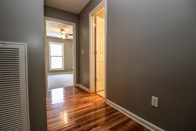 corridor featuring hardwood / wood-style floors