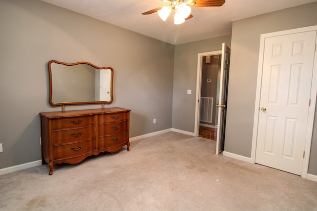 bedroom with ceiling fan and light colored carpet