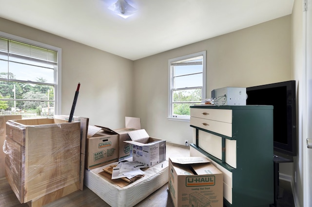 miscellaneous room with dark wood-type flooring