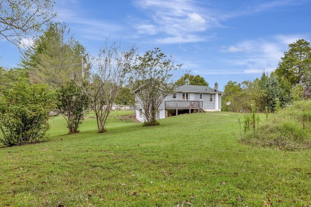 view of yard with a wooden deck