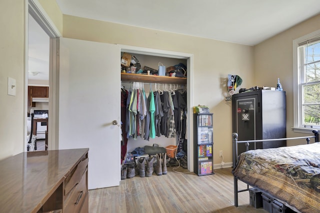 bedroom featuring light hardwood / wood-style flooring and a closet