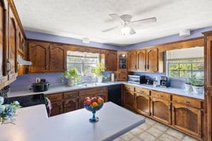 kitchen with dishwasher, ceiling fan, and range