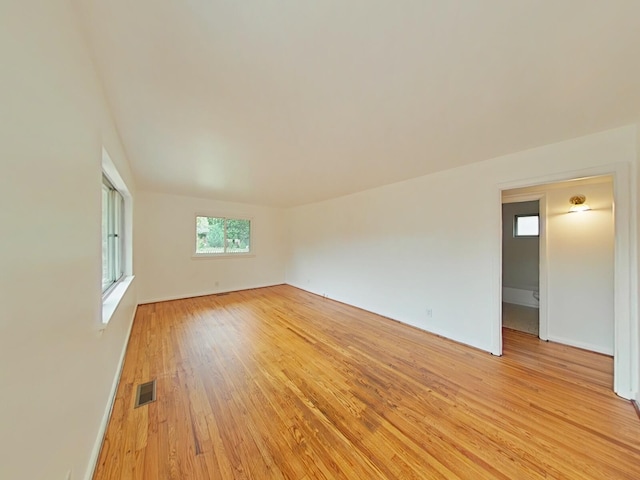 spare room featuring light hardwood / wood-style floors