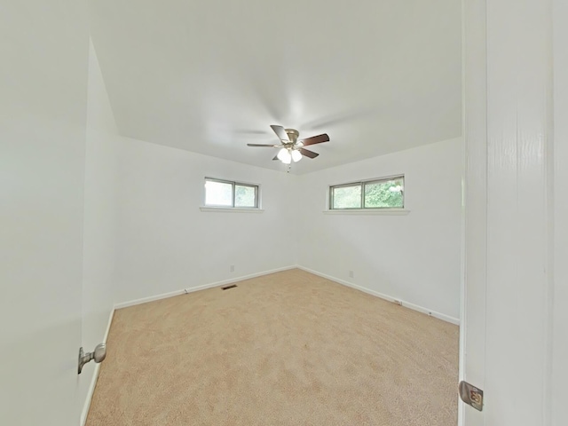 carpeted empty room with ceiling fan