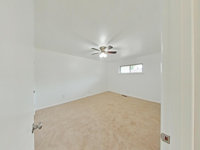 carpeted empty room with ceiling fan