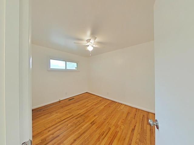 unfurnished room with light wood-type flooring and ceiling fan