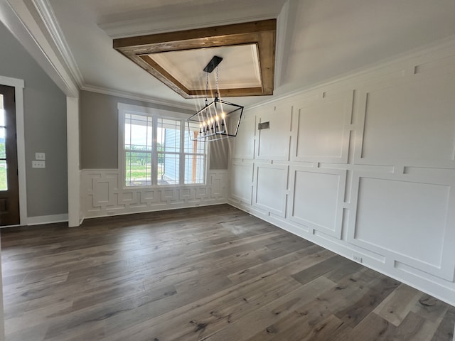 unfurnished dining area featuring a tray ceiling, ornamental molding, dark hardwood / wood-style flooring, and a chandelier