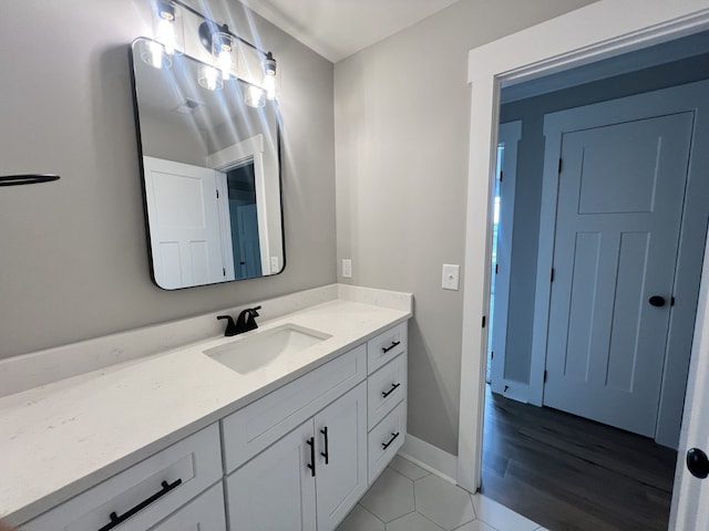 bathroom with vanity and hardwood / wood-style flooring