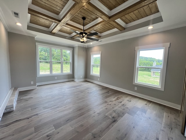 spare room with ceiling fan, light hardwood / wood-style flooring, ornamental molding, and a healthy amount of sunlight