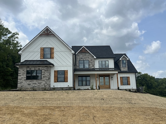 modern farmhouse style home with central AC unit