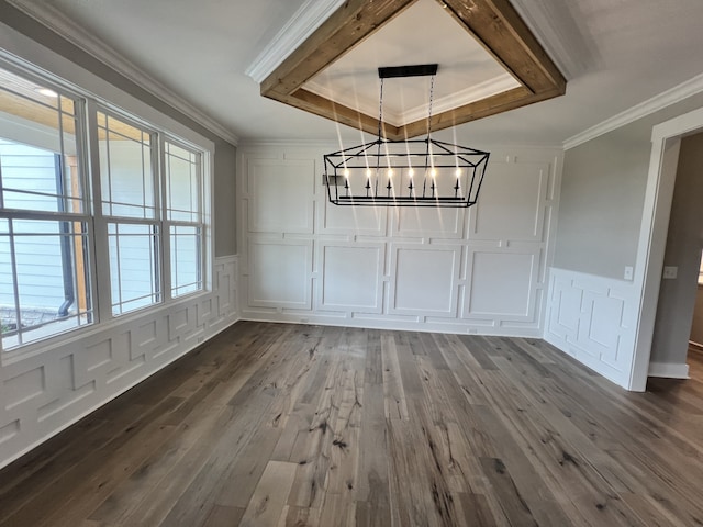 unfurnished dining area featuring ornamental molding, a chandelier, hardwood / wood-style floors, and a wealth of natural light