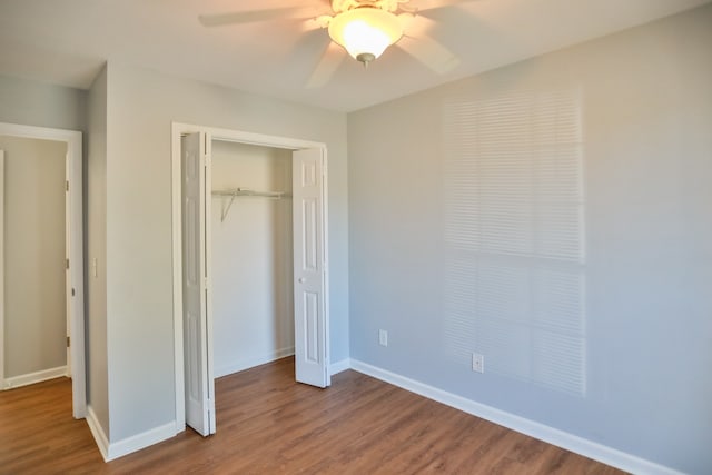 unfurnished bedroom featuring wood-type flooring, ceiling fan, and a closet