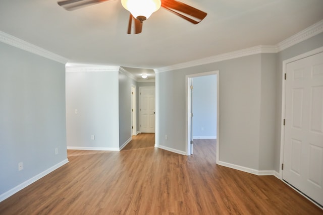 unfurnished room with ceiling fan, hardwood / wood-style floors, and ornamental molding