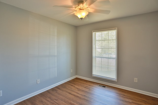 unfurnished room featuring hardwood / wood-style floors and ceiling fan