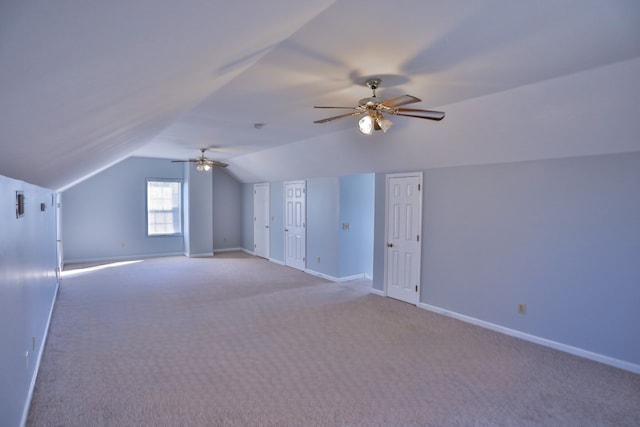 bonus room featuring lofted ceiling, light carpet, and ceiling fan