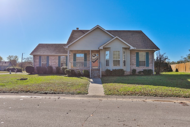 view of front of property featuring a porch and a front lawn