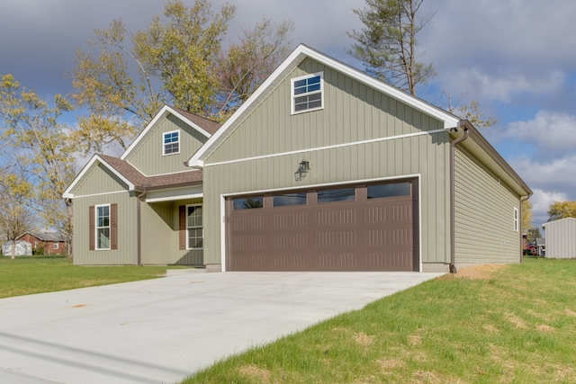 view of front of home with a front yard and a garage