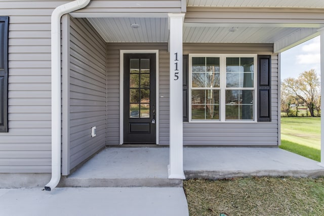 doorway to property featuring covered porch