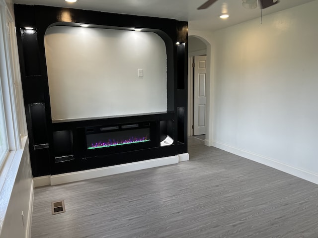 interior space with ceiling fan and hardwood / wood-style flooring