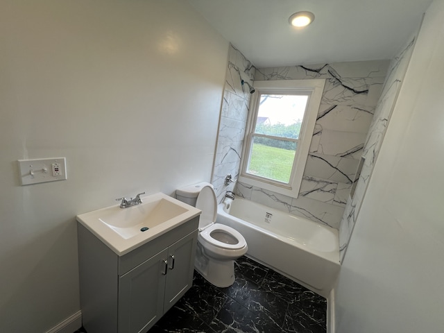 full bathroom featuring vanity, toilet, and tiled shower / bath