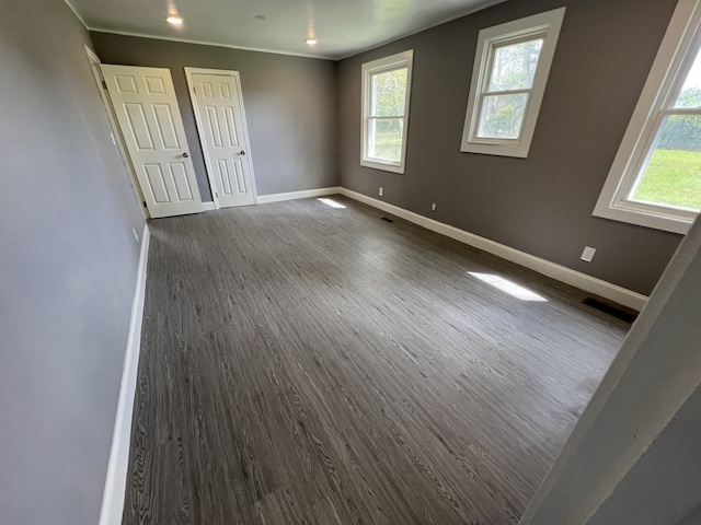 interior space with dark hardwood / wood-style flooring