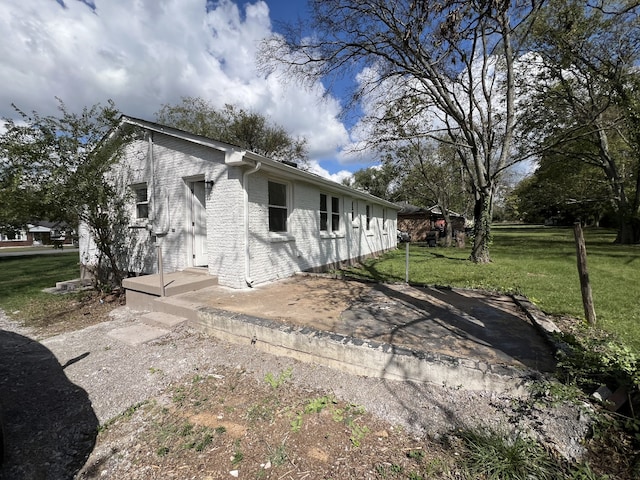 exterior space with a yard