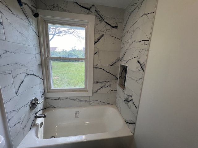 bathroom with shower / tub combination