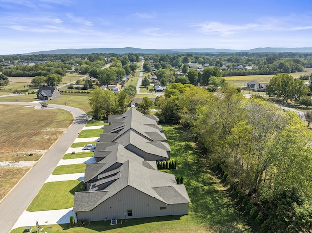 birds eye view of property with a mountain view