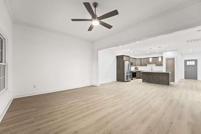 unfurnished living room with ceiling fan, light wood-type flooring, and ornamental molding