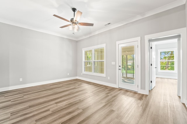 spare room featuring ceiling fan, ornamental molding, and light hardwood / wood-style floors