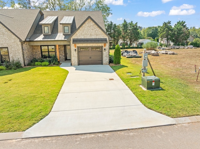 view of front facade featuring a garage and a front lawn