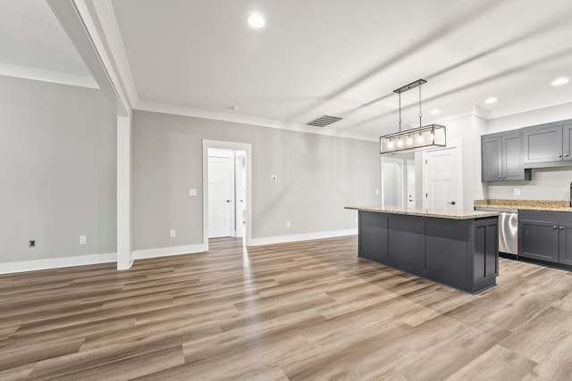 kitchen with gray cabinetry, light hardwood / wood-style flooring, and a kitchen island