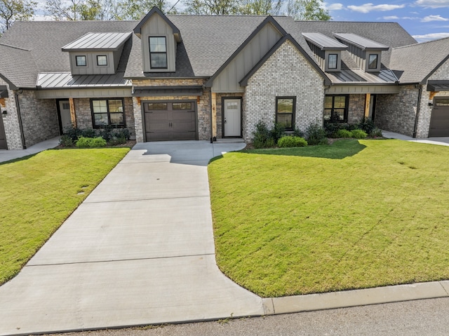 view of front of property featuring a front lawn and a garage