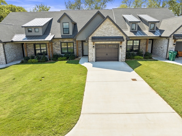 view of front of house with a garage and a front lawn