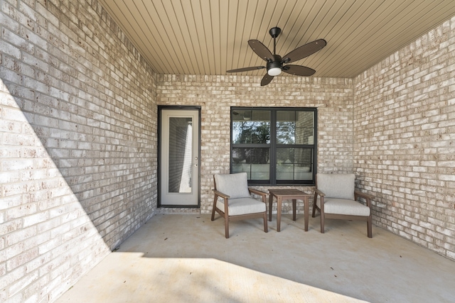 doorway to property featuring a patio and ceiling fan