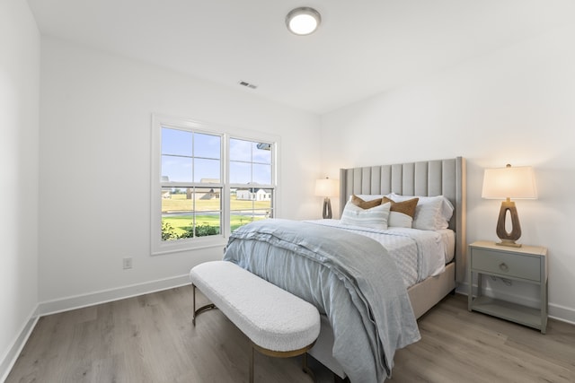 bedroom with light hardwood / wood-style flooring