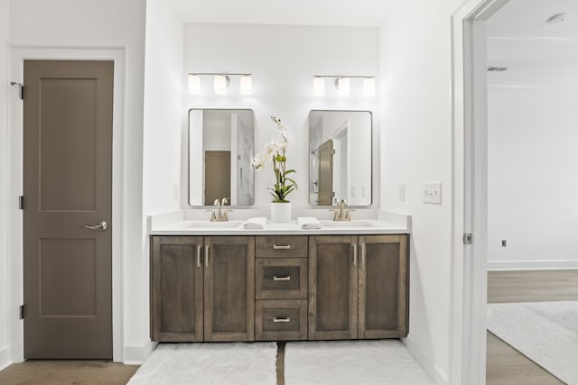 bathroom featuring wood-type flooring and vanity