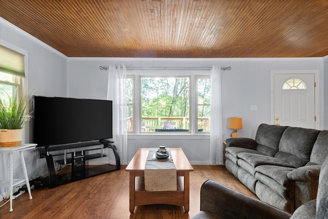living area featuring crown molding, wood finished floors, and wood ceiling