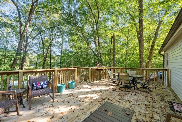 wooden deck featuring outdoor dining space
