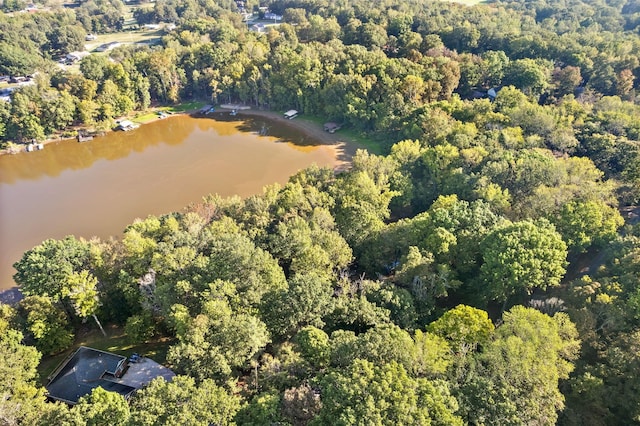 drone / aerial view featuring a water view and a forest view