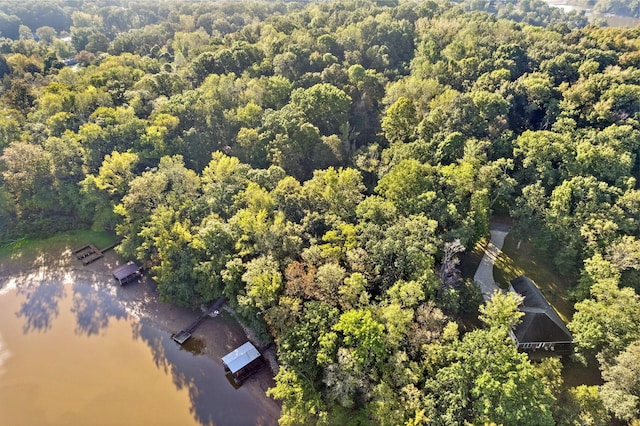 birds eye view of property with a wooded view
