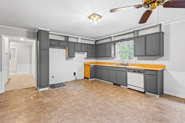 kitchen with ornamental molding, white dishwasher, sink, and gray cabinets