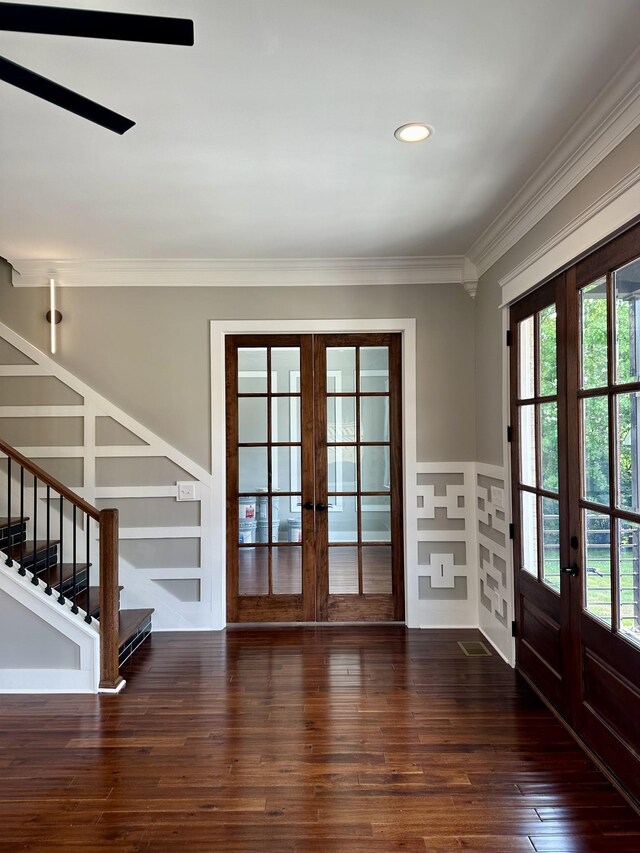 doorway to outside with dark hardwood / wood-style flooring, ornamental molding, and french doors