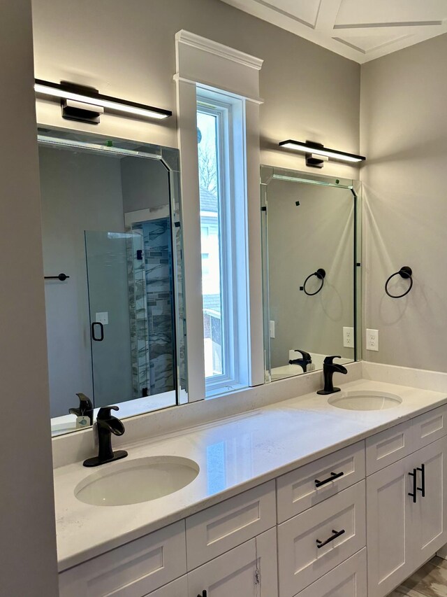 bathroom with an enclosed shower and vanity